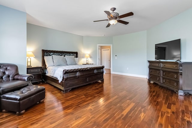 bedroom featuring wood finished floors, baseboards, and ceiling fan