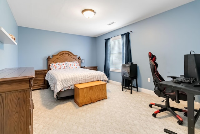 bedroom featuring light carpet, baseboards, and visible vents