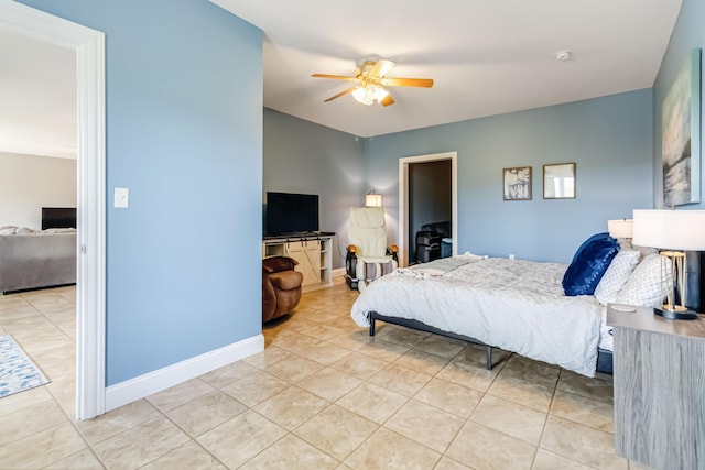bedroom with light tile patterned flooring, a ceiling fan, and baseboards
