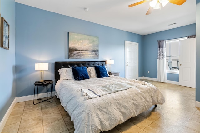 bedroom with visible vents, tile patterned floors, and baseboards