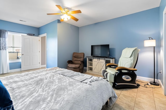 bedroom featuring visible vents, tile patterned flooring, baseboards, and ceiling fan