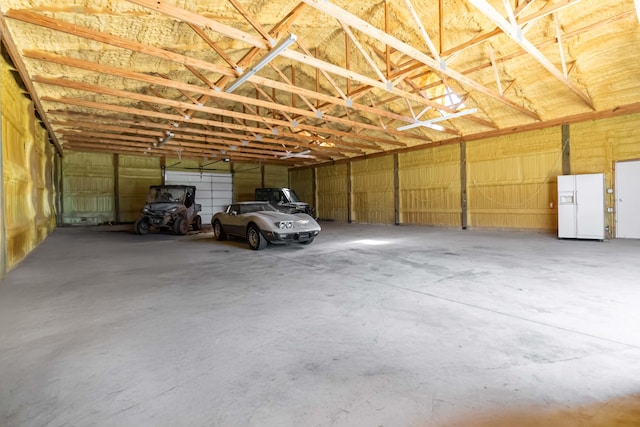 garage with white refrigerator with ice dispenser