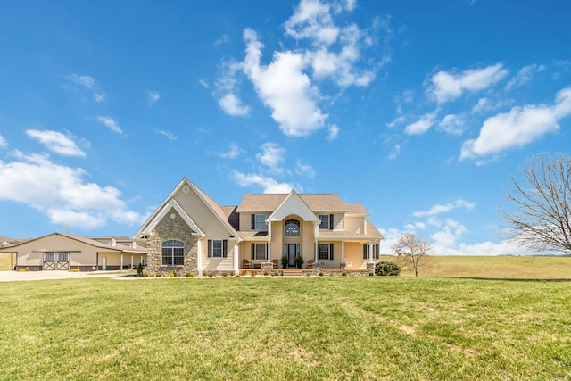 craftsman house featuring a front lawn and stone siding