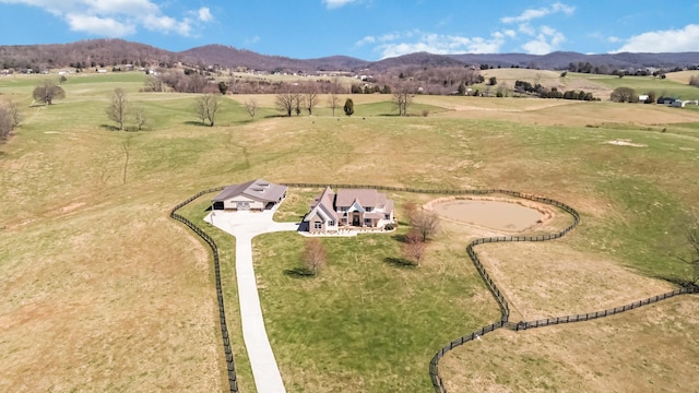 birds eye view of property featuring a mountain view and a rural view