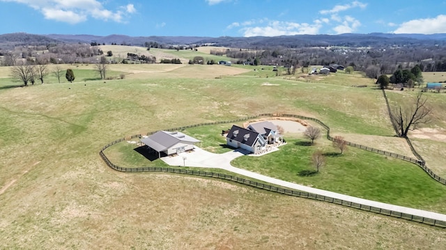 drone / aerial view featuring a mountain view and a rural view