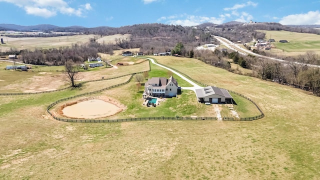 bird's eye view featuring a rural view and a mountain view