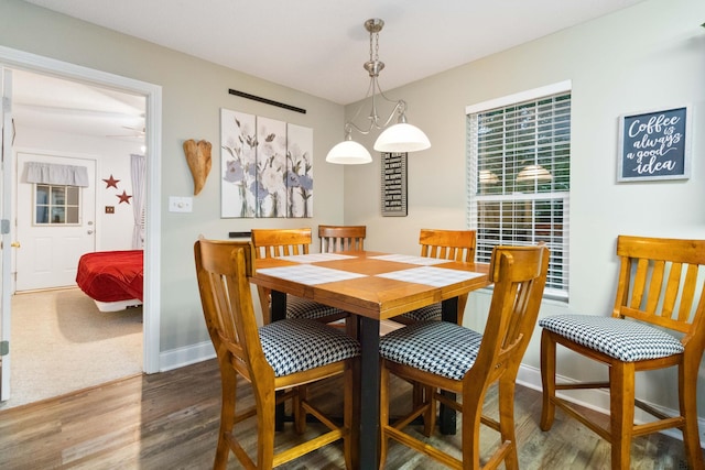 dining room with wood finished floors and baseboards