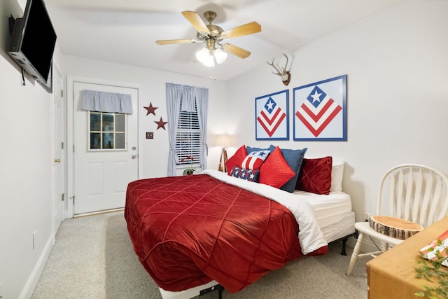 carpeted bedroom with baseboards and a ceiling fan