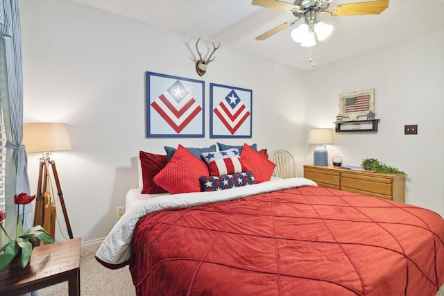 bedroom featuring carpet, a ceiling fan, and baseboards
