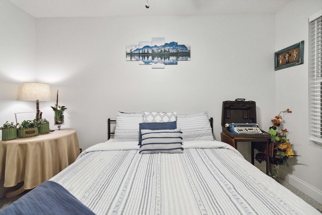 bedroom featuring baseboards