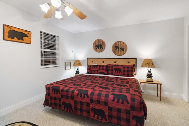 bedroom featuring ceiling fan, baseboards, and carpet flooring