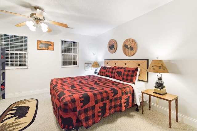 bedroom featuring carpet floors, a ceiling fan, and baseboards