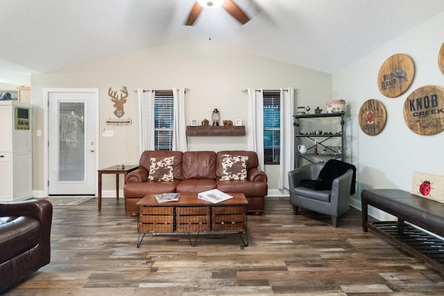 living room with lofted ceiling, baseboards, a ceiling fan, and wood finished floors