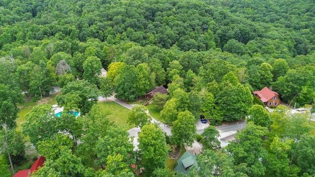 bird's eye view featuring a wooded view