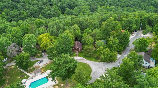 drone / aerial view featuring a forest view