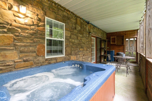 deck with an indoor hot tub