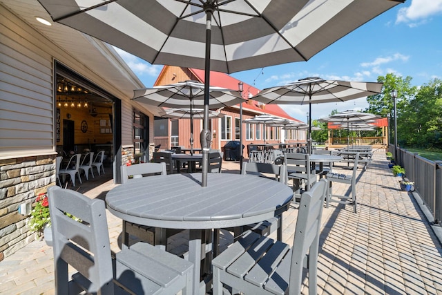 view of patio featuring outdoor dining area