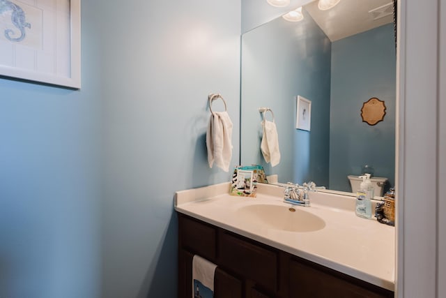 bathroom featuring vanity and visible vents