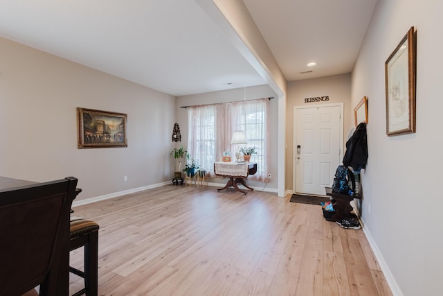 entrance foyer featuring recessed lighting, baseboards, and light wood-type flooring