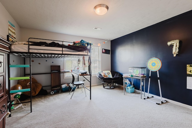bedroom featuring carpet floors, baseboards, and visible vents