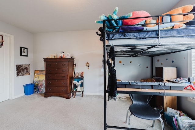 carpeted bedroom featuring baseboards
