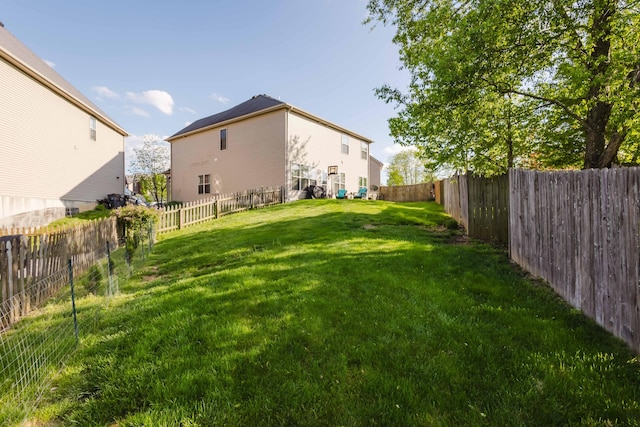 view of yard with a fenced backyard