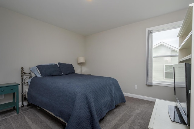 carpeted bedroom with baseboards