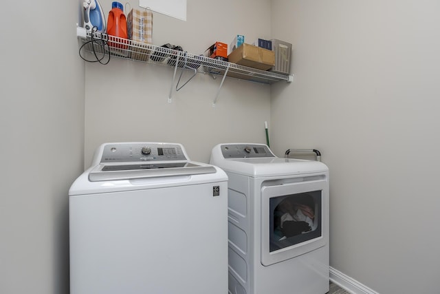 laundry room featuring washer and dryer and laundry area