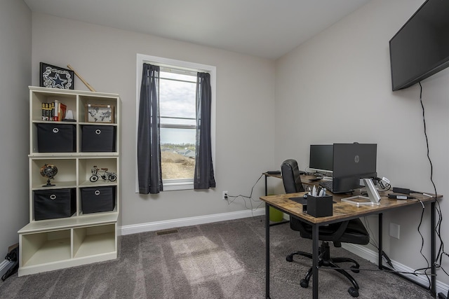 office space featuring baseboards, visible vents, and carpet floors