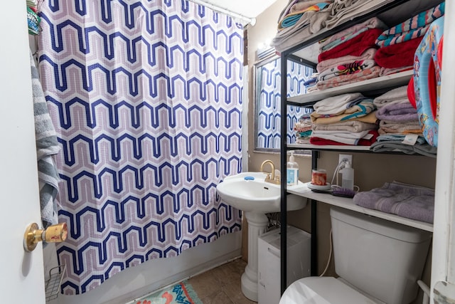 full bath with tile patterned flooring, a shower with shower curtain, and toilet