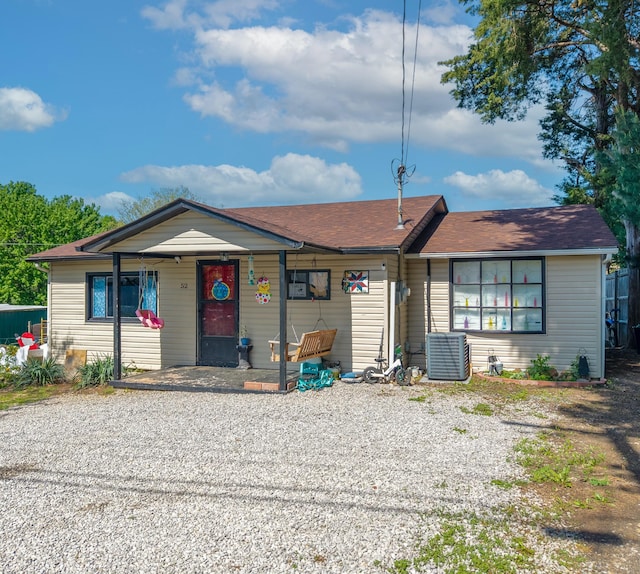view of front of house with central air condition unit and a porch