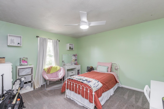 bedroom featuring carpet floors, a textured ceiling, baseboards, and ceiling fan