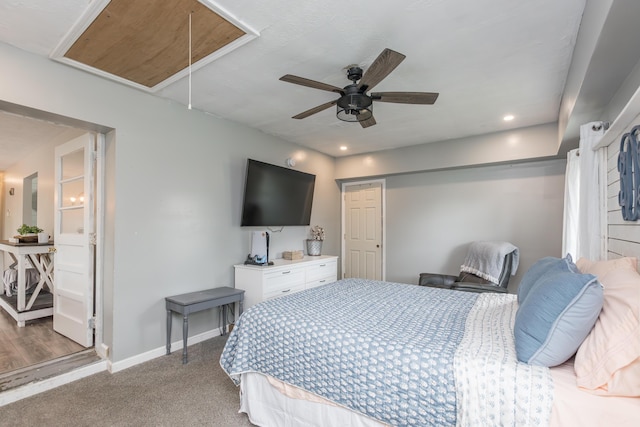 carpeted bedroom with a ceiling fan, baseboards, recessed lighting, and attic access