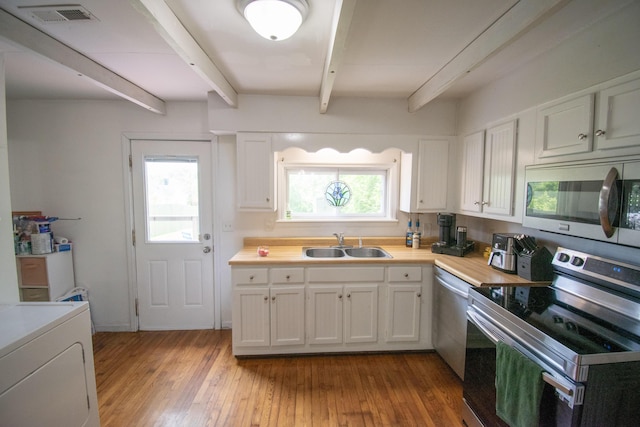 108 Central Ct, Richmond, KY 40475 - kitchen featuring appliances with stainless steel finishes, a sink, beamed ceiling, and white cabinets