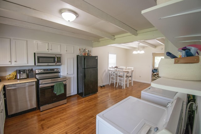 108 Central Ct, Richmond, KY 40475 - kitchen with stainless steel appliances, white cabinetry, beamed ceiling, light wood-style floors, and a chandelier