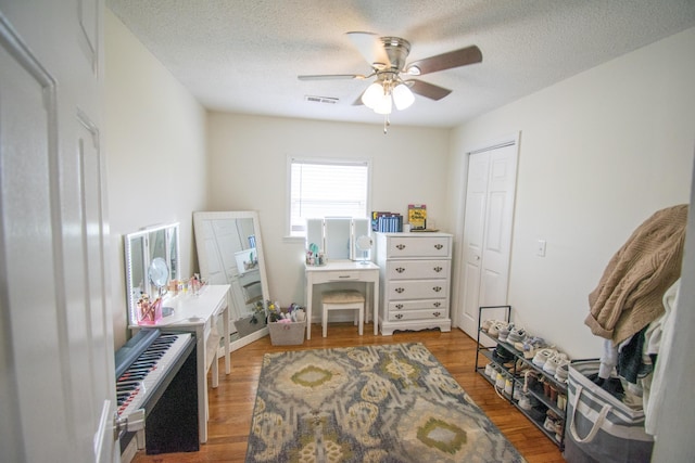 108 Central Ct, Richmond, KY 40475 - bedroom with a textured ceiling, a closet, wood finished floors, ceiling fan, and radiator heating unit