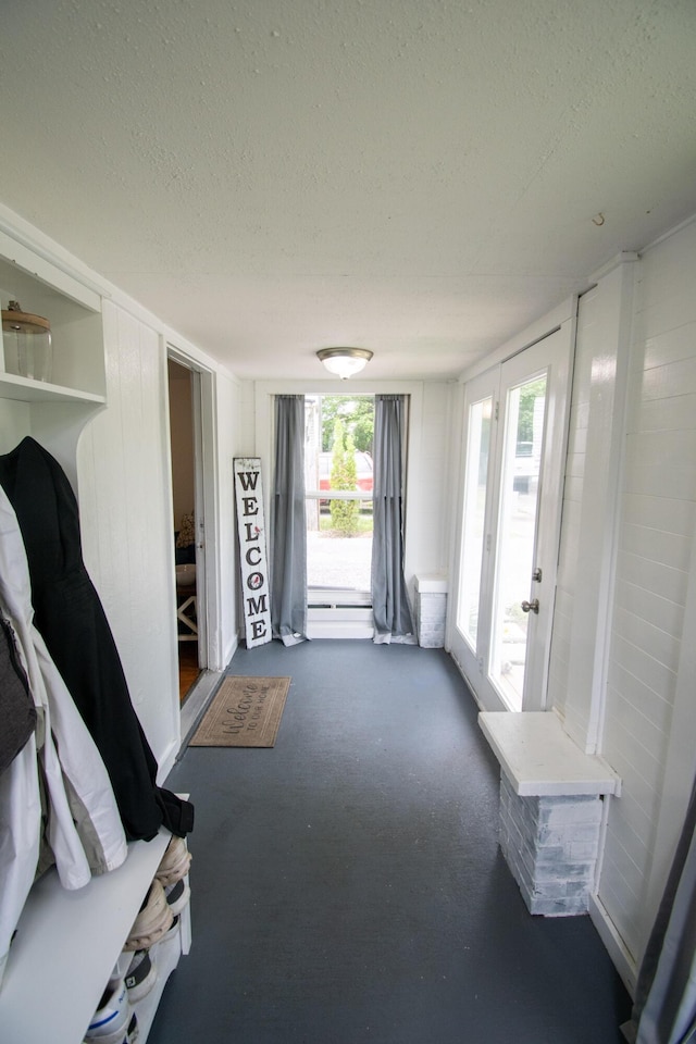 108 Central Ct, Richmond, KY 40475 - mudroom featuring a textured ceiling, plenty of natural light, and dark carpet