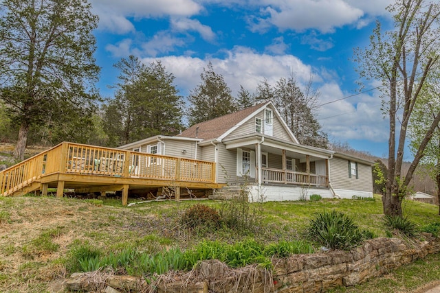 rear view of house with covered porch