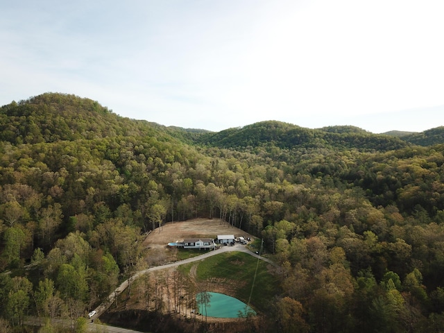 bird's eye view featuring a mountain view and a forest view