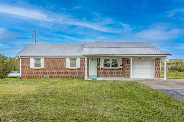 122 Barker Way, Lancaster, KY 40444 - ranch-style house featuring asphalt driveway, brick siding, an attached garage, and a front lawn