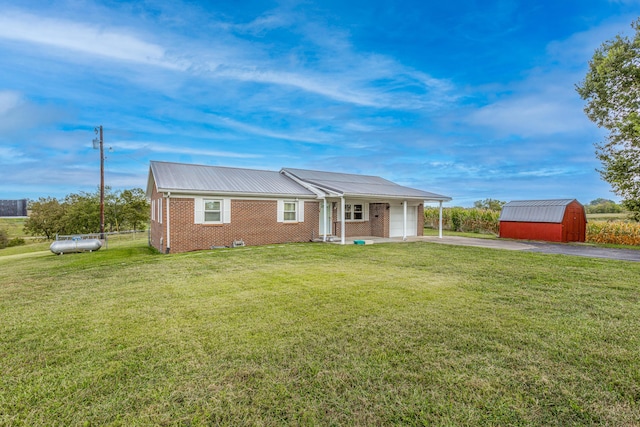 122 Barker Way, Lancaster, KY 40444 - ranch-style house featuring brick siding, driveway, a storage shed, an attached garage, and a front yard