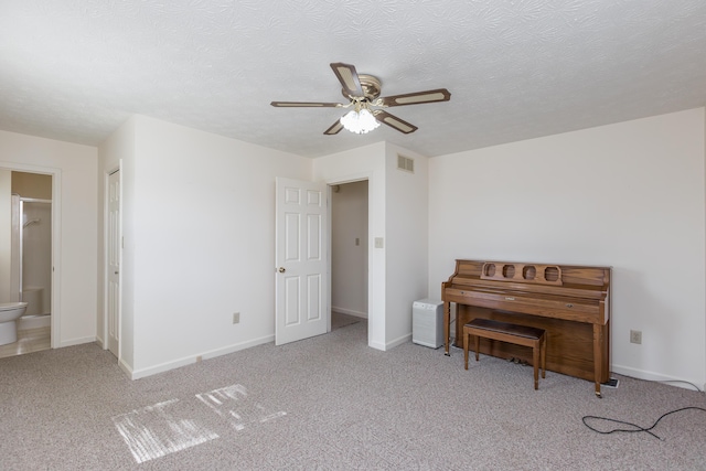 122 Barker Way, Lancaster, KY 40444 - bedroom with baseboards, carpet floors, a textured ceiling, a ceiling fan, and ensuite bath