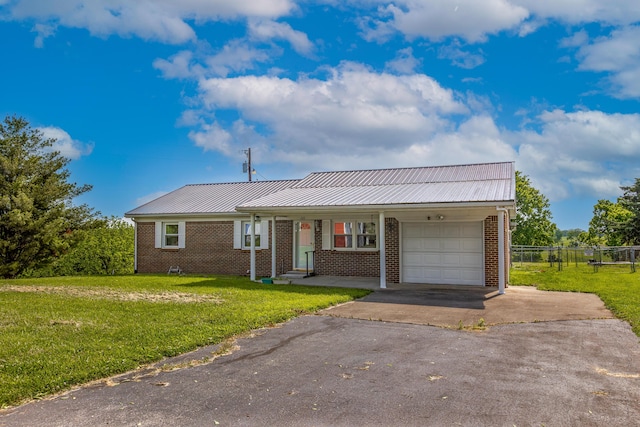 122 Barker Way, Lancaster, KY 40444 - ranch-style house featuring a garage, asphalt driveway, brick siding, and metal roof