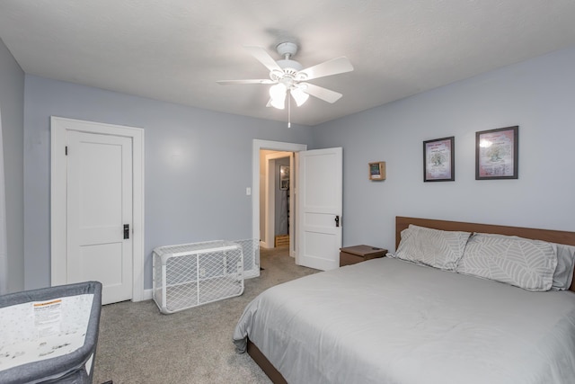 bedroom featuring ceiling fan, carpet flooring, and baseboards