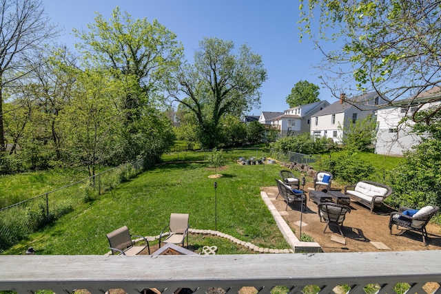 view of yard with a patio, a fire pit, and a fenced backyard