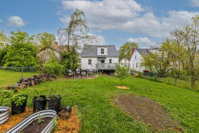 view of yard with a patio and a fenced backyard