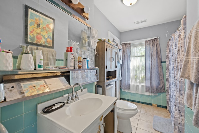 full bathroom featuring vanity, tile patterned flooring, toilet, and visible vents