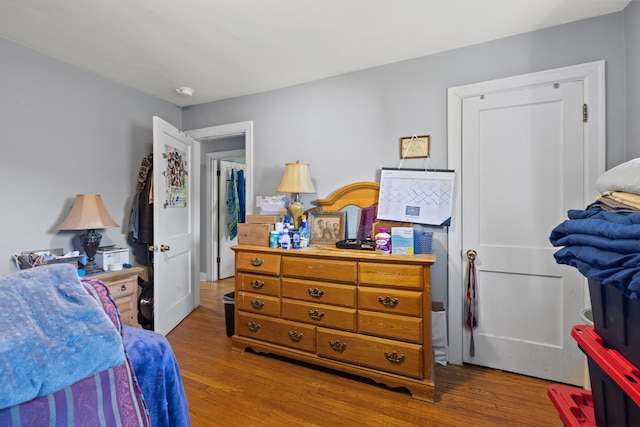 bedroom featuring wood finished floors