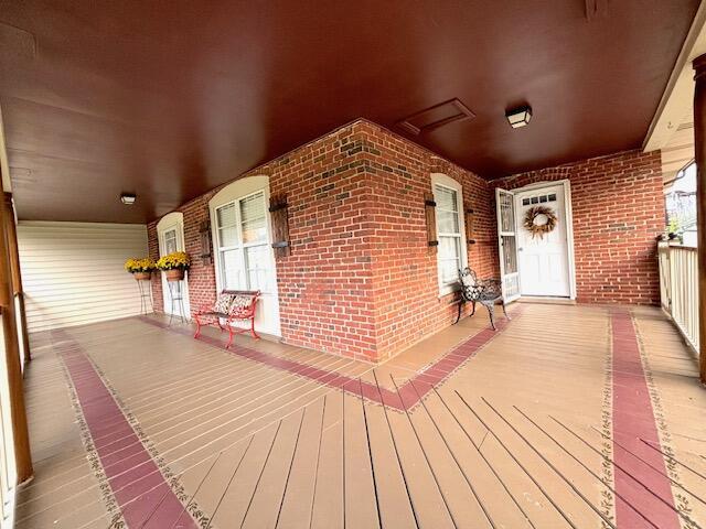 wooden terrace with a porch