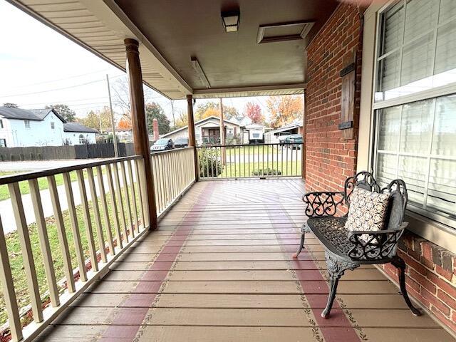 wooden terrace with a residential view